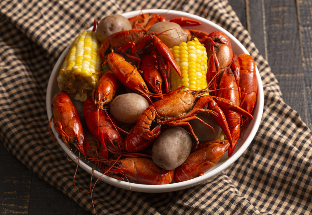 A plate from a Crawfish Boil with Crawfish, Corn on the Cob and Potatoes