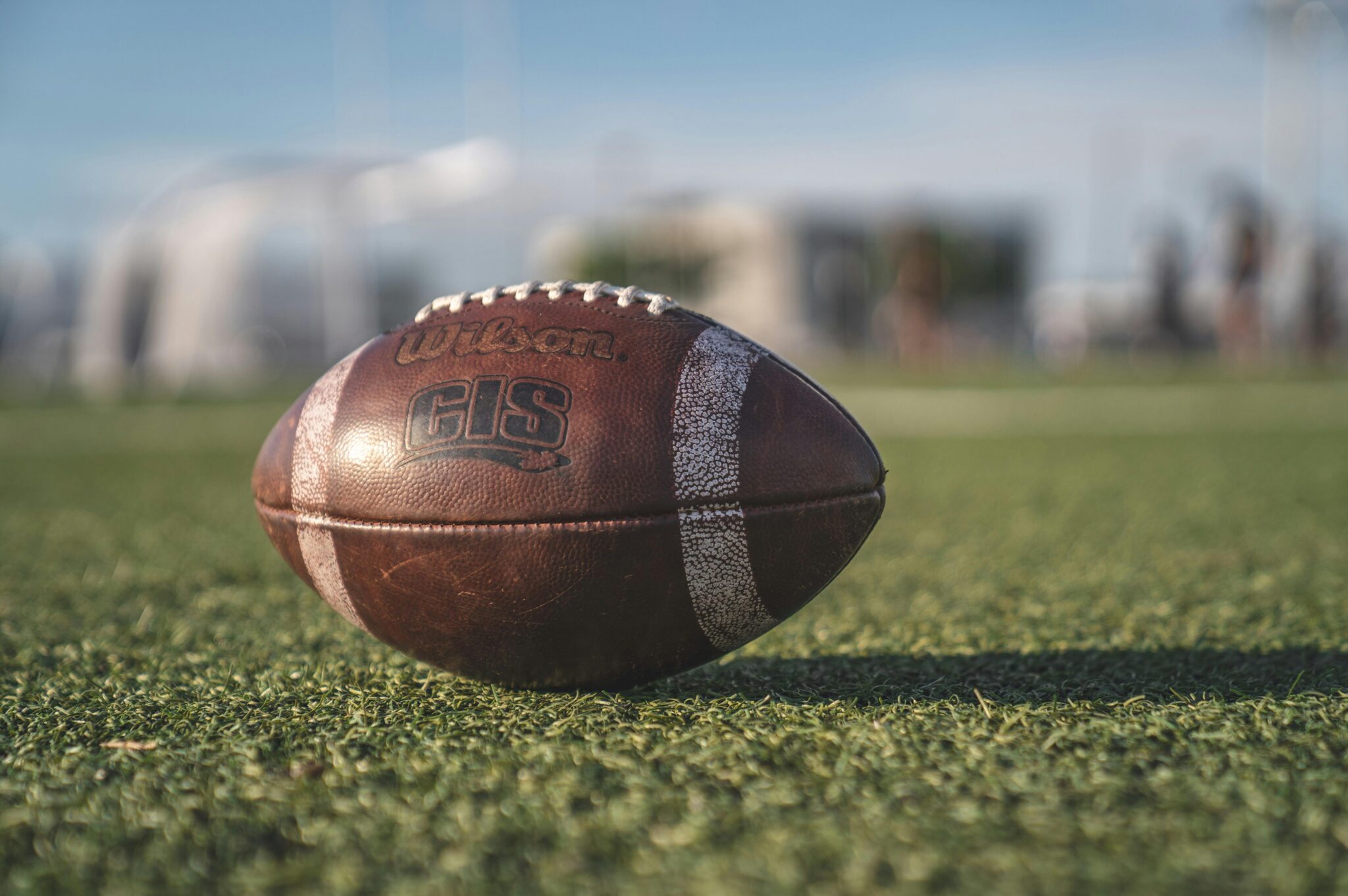 an football from the super bowl in a field